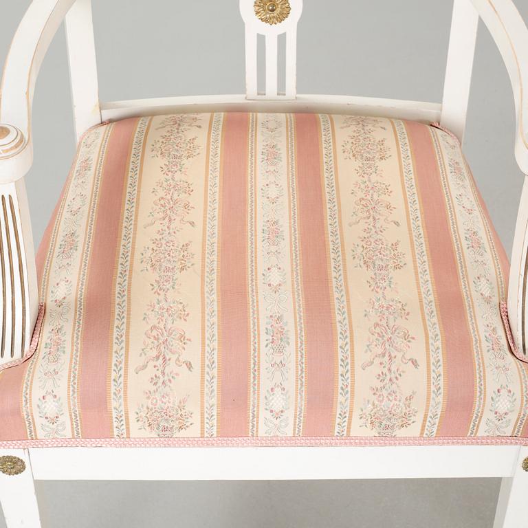 Two gustavian style armchairs and three chairs, first half of the 20th century.