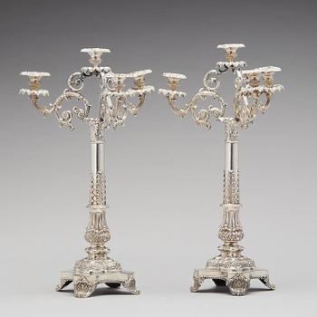 A pair of Swedish Empire silver candelabra, mark of Gustaf Mollenborg, Stockholm 1838.