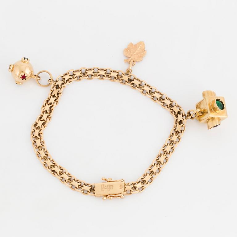 A charm bracelet, 18K gold.