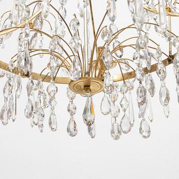 A Gustavian four-branch gilt-brass chandelier, Stockholm, late 18th century.