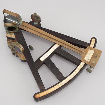 A turn of the century 1900 octant with case by F.M Moore.