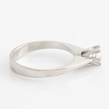 Ring solitaire with brilliant-cut diamond.