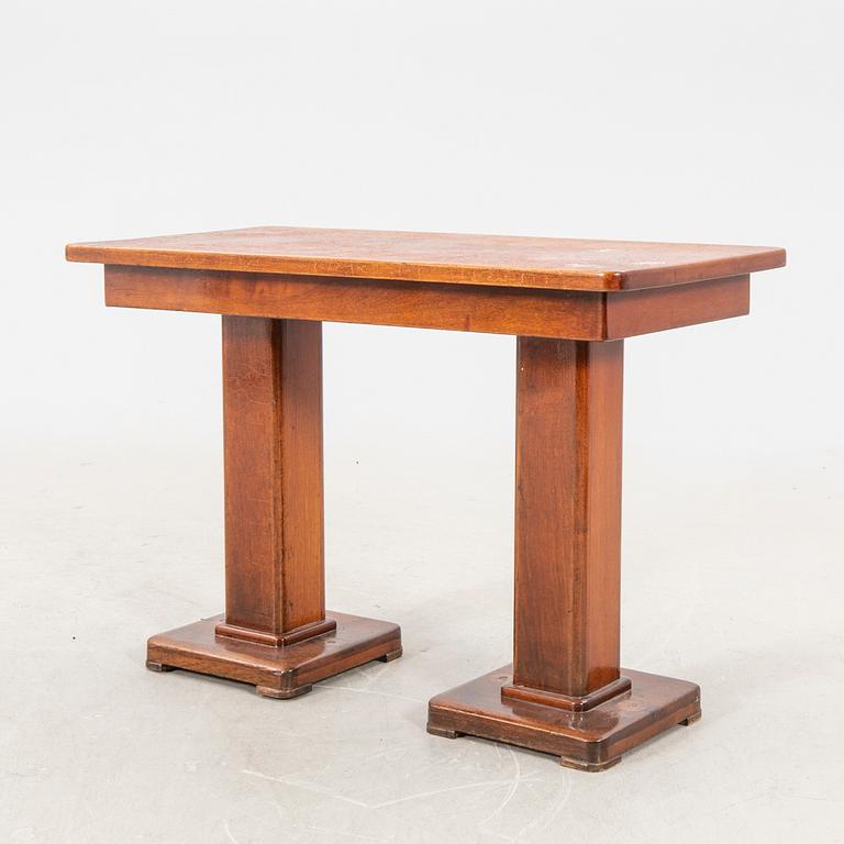 A set of table and two benches from a ship 20th century.