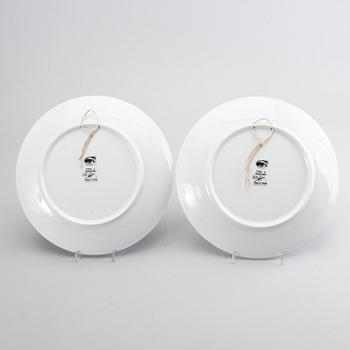 PIERO FORNASETTI, a set of two porcelain plates.