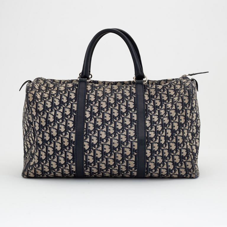 Christian Dior, a canvas handbag, toilet bag and key holder.