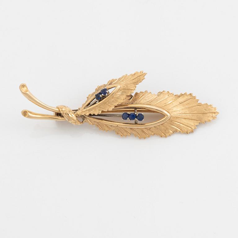 14K gold and sapphire leaf brooch.