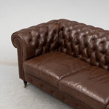 A modern chesterfield sofa.