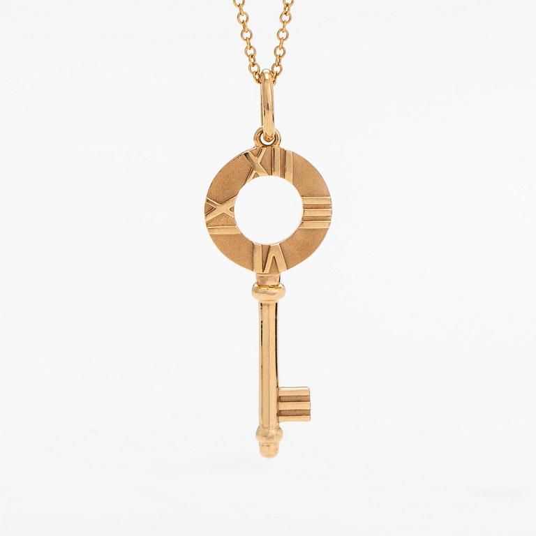 Tiffany & Co, an 18K gold 'Atlas Key' pendant with chain.