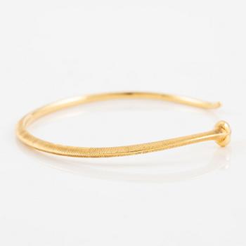 An Ole Lynggaard bracelet 18K gold in the shape of a snake.
