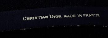 An ensemble consisting of skirt, top, belt and scarf by Christian Dior.