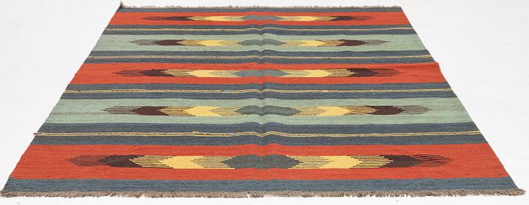 A kilim rug, c 242 x 181 cm.