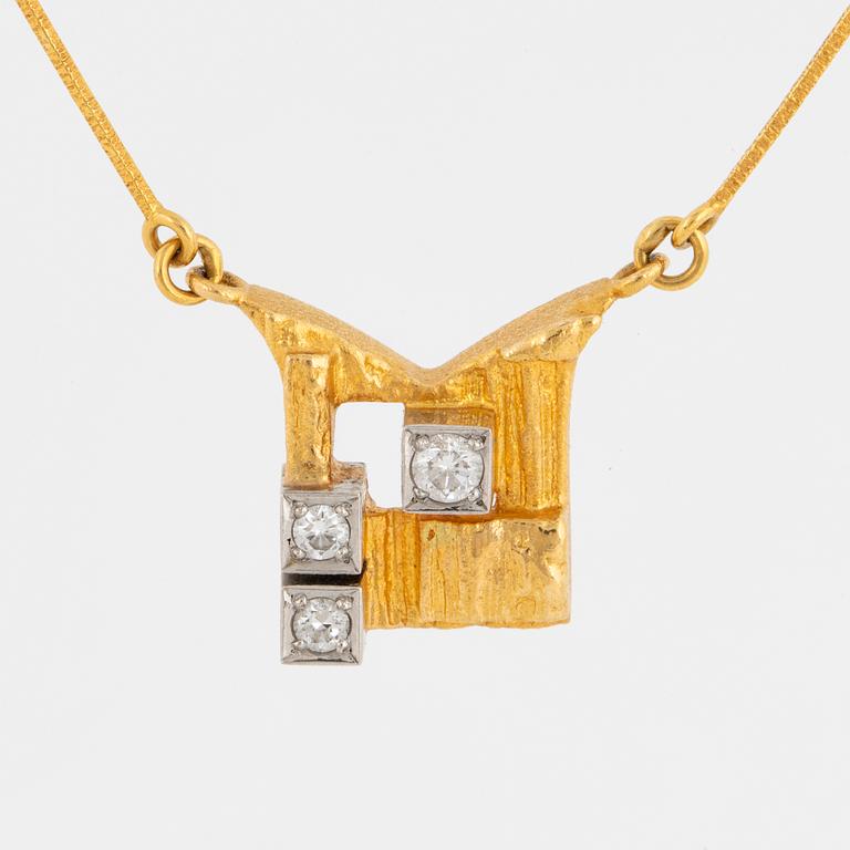 A Björn Weckström 18K gold necklace with brilliant-cut diamonds.