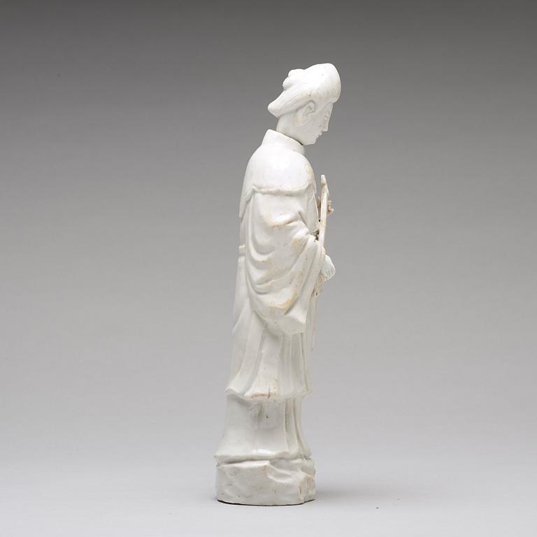 A blanc de chine figure of a lady-in-waiting, Qing dynasty, Kangxi (1662-1722).