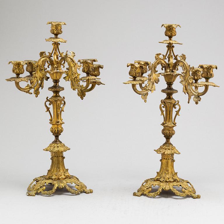 A pair of metal candelabra, late 19th Century.