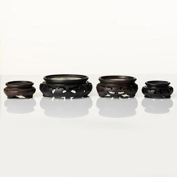 A group of Chinese wooden stands, late Qing dynasty and 21st century.