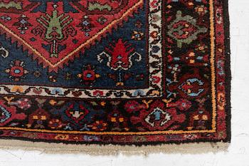An Oriental rug, approx. 200 x 105 cm.