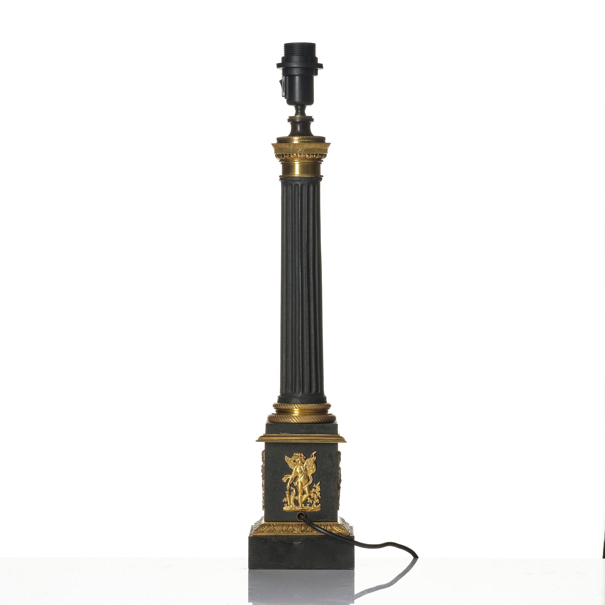 A French Empire ormolu and tole lamp, early 19th century.