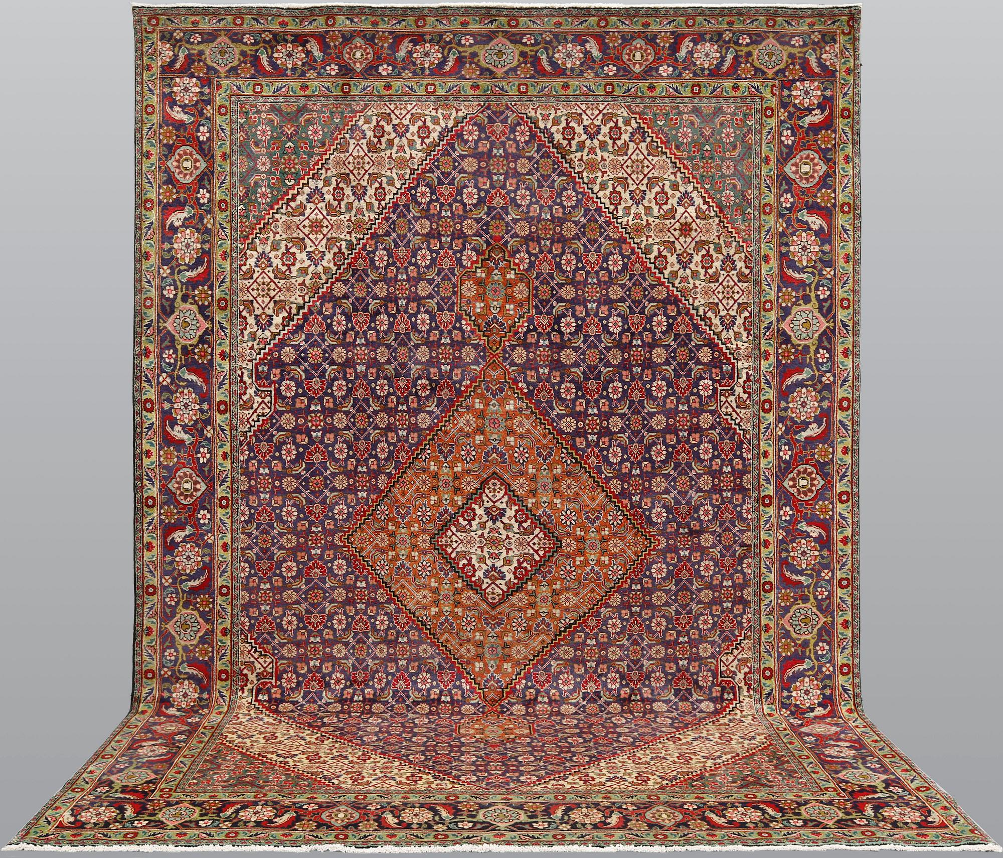 A Tabriz carpet, approximately 360 x 255 cm.