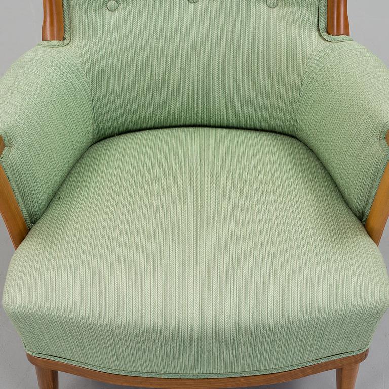 a Carl Malmsten "Vår Fru" armchair from the second half of the 20th century.