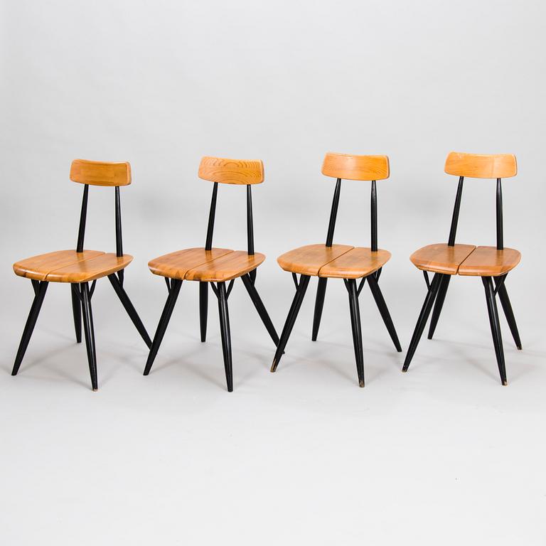 ILMARI TAPIOVAARA, A "Pirkka" table and four chairs manufactured by Laukaan Puu and designed in 1957.