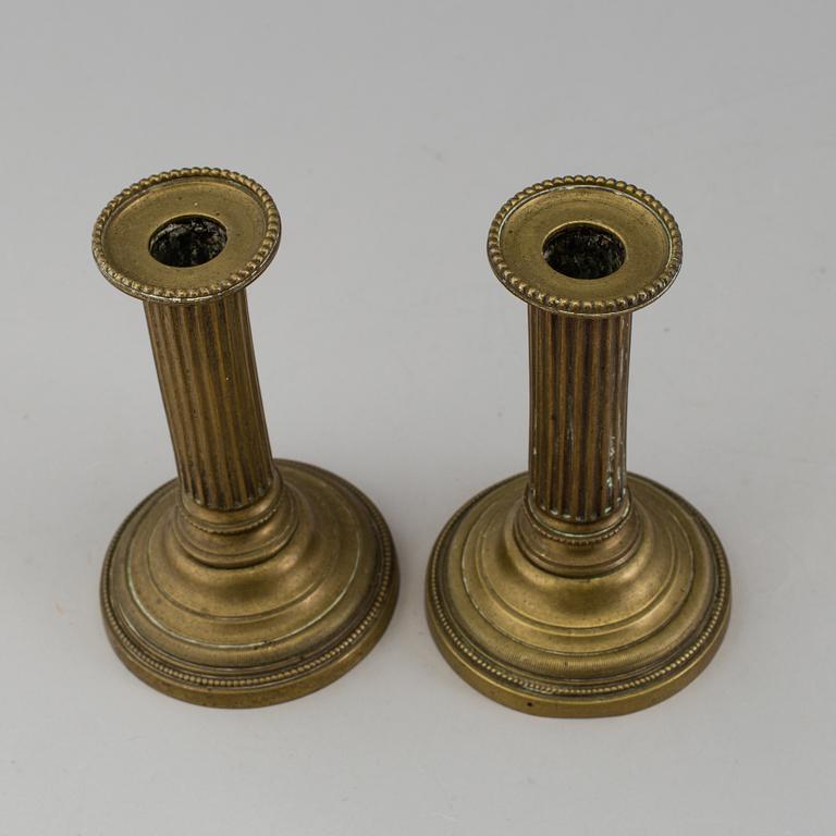 A PAIR OF GUSTAVIAN BRONZE CANDLESTICKS, latter part of the 18th century.