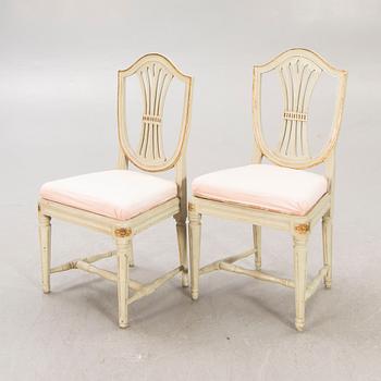 A öpair of painted Gustavian chairs.