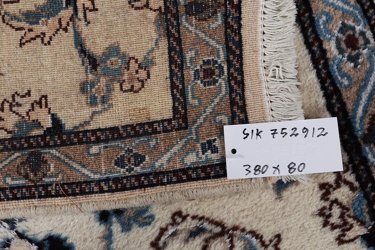 A runner carpet, Nain, part silk, 9 laa, signed, ca. 380 x 80 cm.