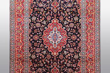 A carpet, Kashan signed Najafi, ca 360 x 231 cm.