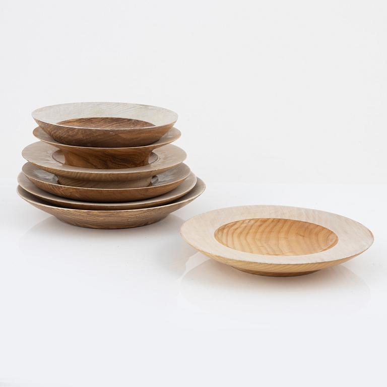 Magnus Ek, a set of seven ash wood plates for Oaxen Krog, 2020.