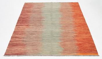 A kilim carpet, 304 x 203 cm.