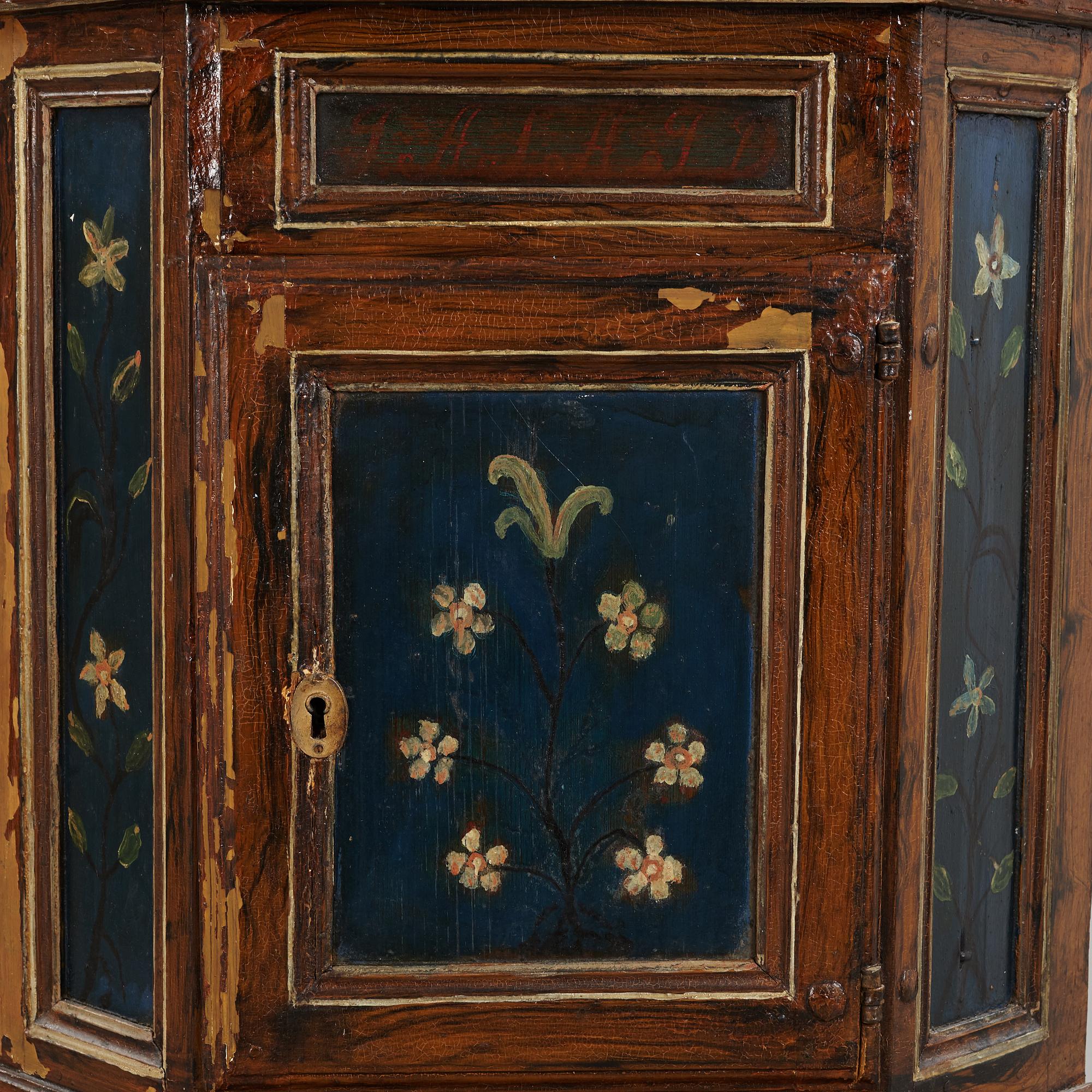 A 18th century corner cabinet.