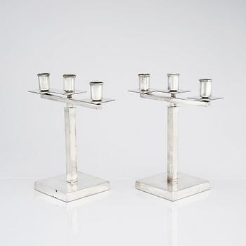 Rolf Engströmer, attributed to, a pair of silver plated candelabra, Fabriksaktiebolaget Kronsilver, Sweden 1930s.