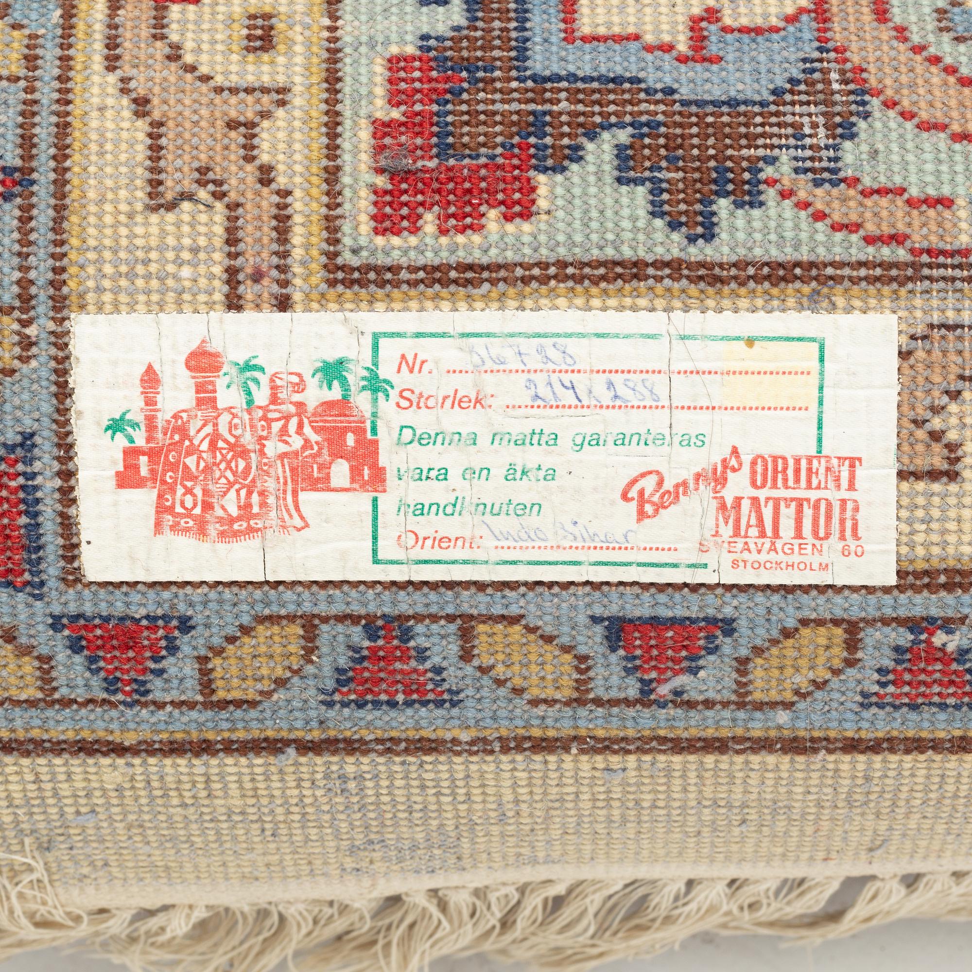 A carpet, signed, circa 286 x 212 cm.