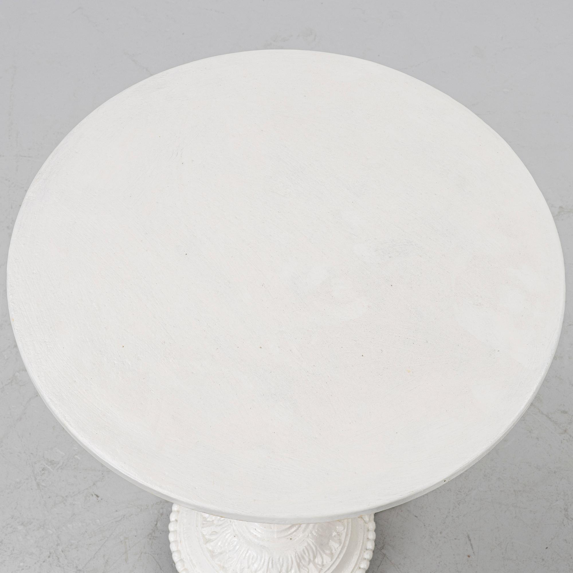 A pair of café tables, around 1900.