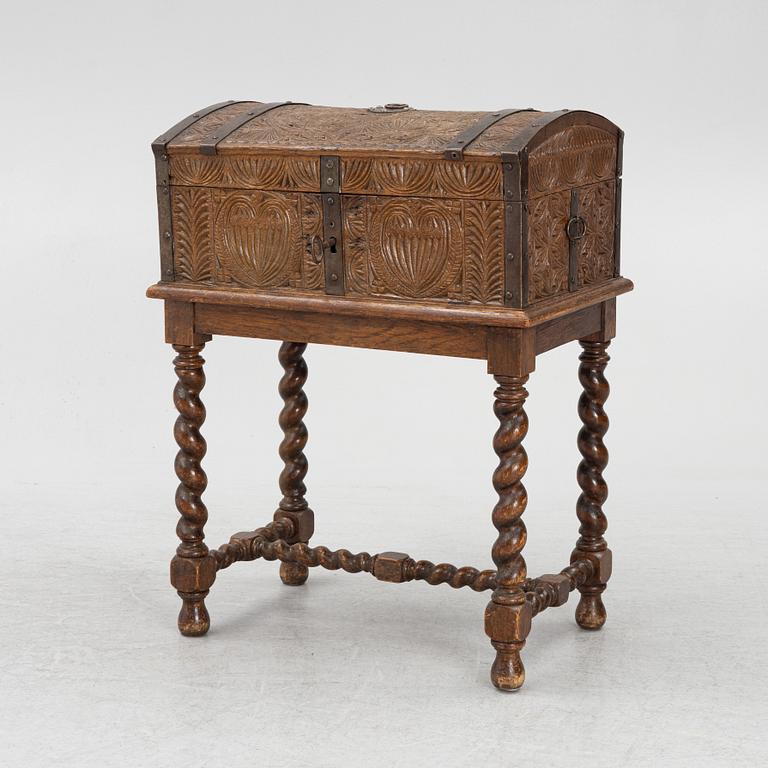 A carved oak box, 19th Century.
