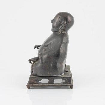 A bronze figure of Buddai, Qing dynasty (1664-1912).