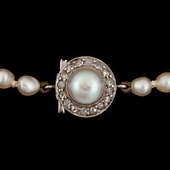 A necklace with semi-baroque natural pearls, Ø 2.7 - 6.2 mm.
