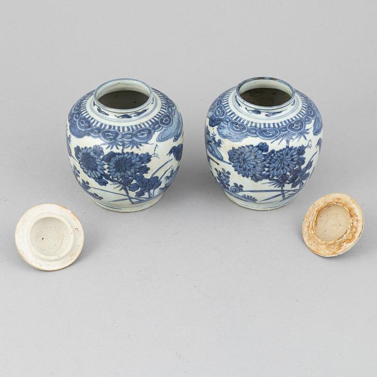 A pair of Chinese blue and white jars with covers, and one jar, Ming dynasty (1368-1644).