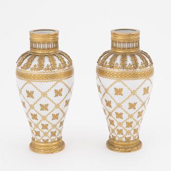 A pair of brass-mounted porcelain  vases, Sèvres mock marks, around 1900.