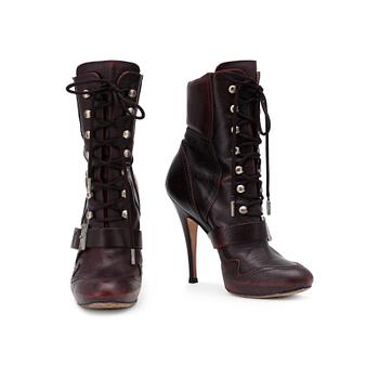 JOHN GALLIANO, a pair of brown leather boots.