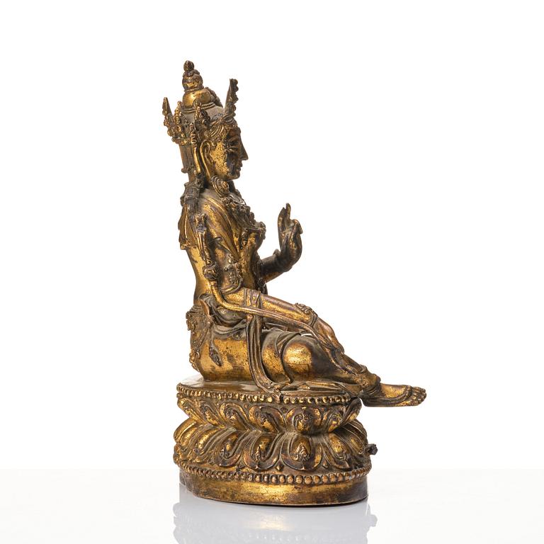 A large gilt copper alloy figure of Tara, Ming dynasty (1368-1644).