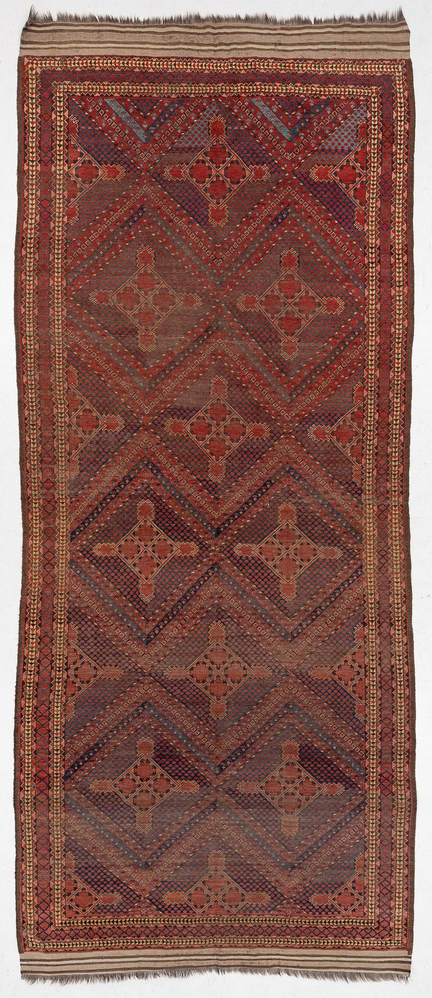 An antique Beshir carpet, ca 495 x 206 cm, around the year 1875.