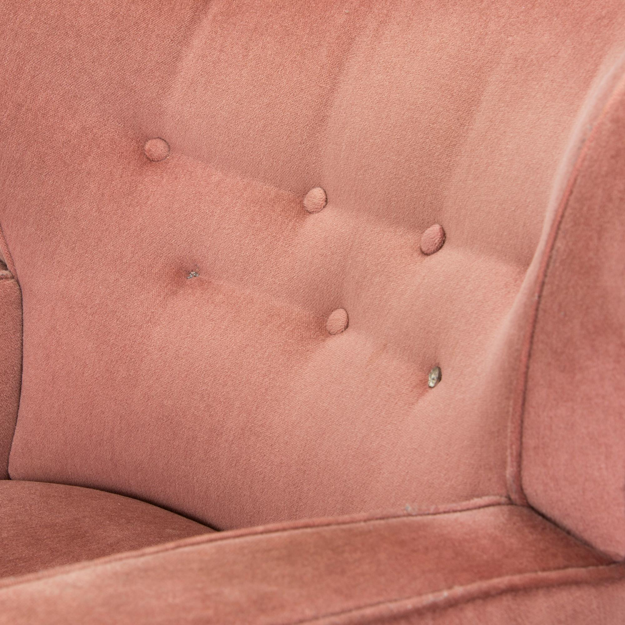 A pair of mid-20th century armchairs.