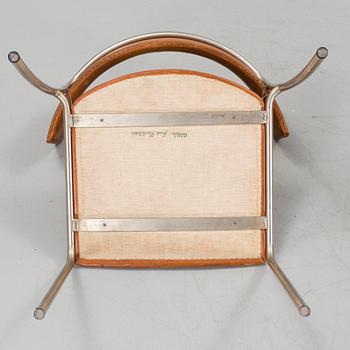 A pair of Erik Karlström leather upholstry chairs, circa 1965.