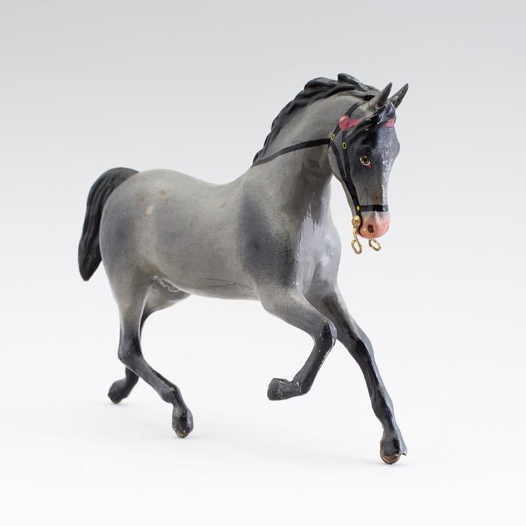 A painted tinplate toy horse ca year 1900.