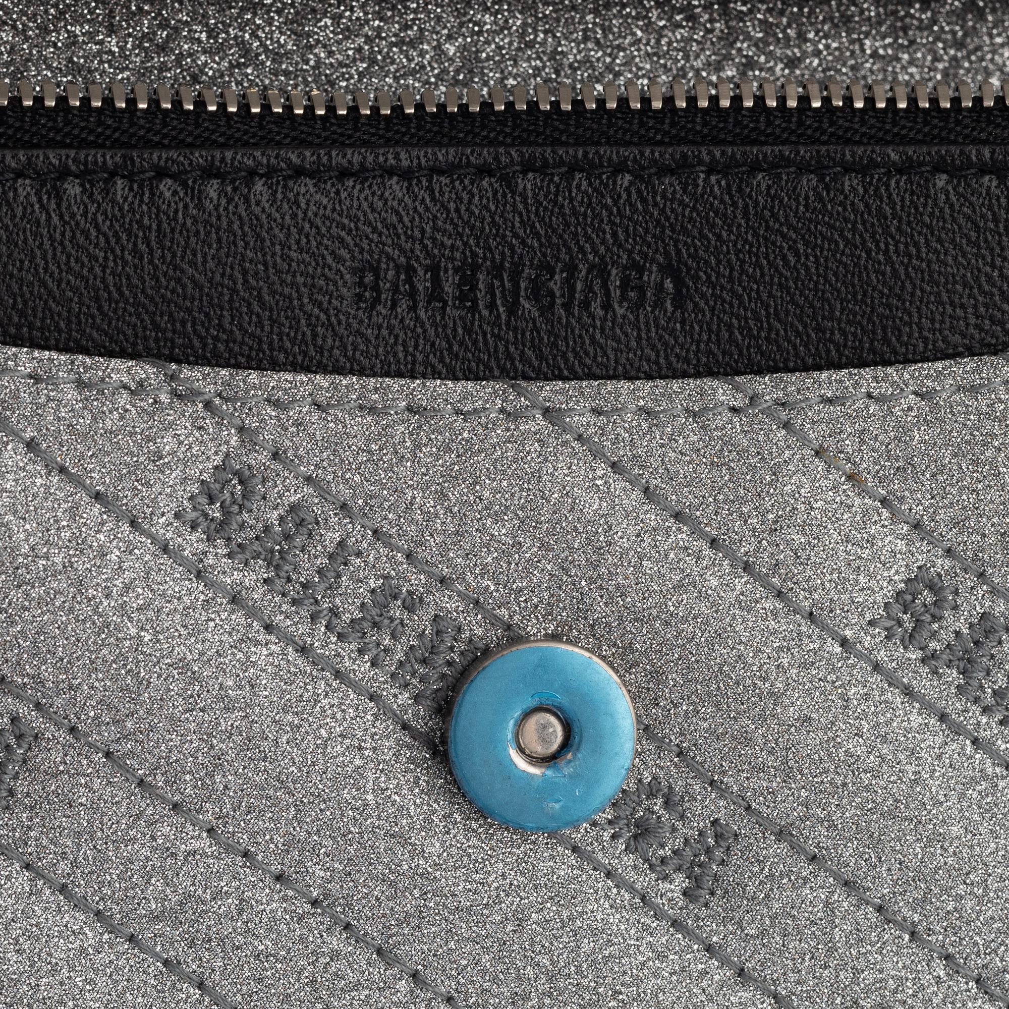 Balenciaga, a 'BB Round glitter bag'.