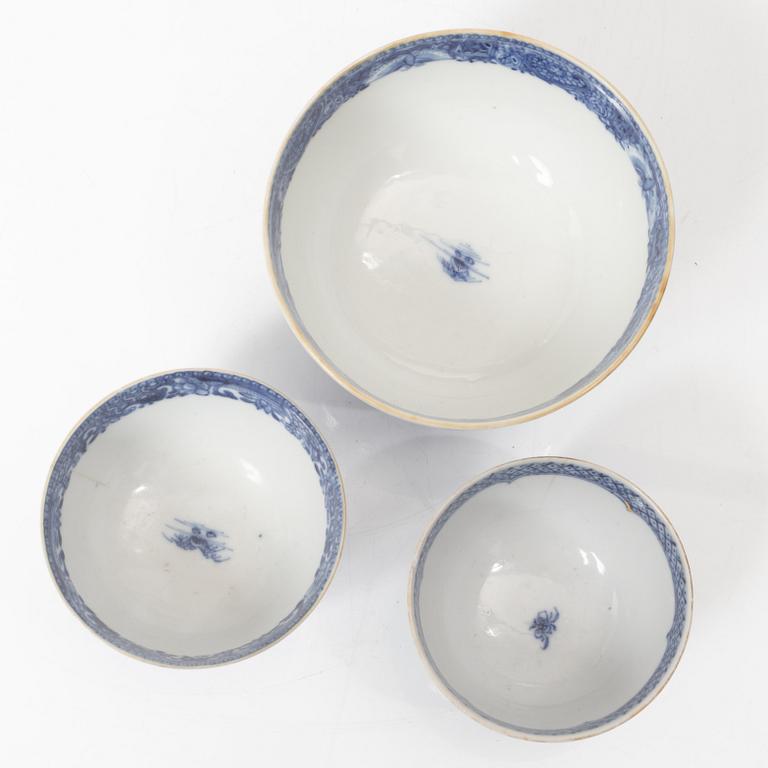 A Chinese blue and white jug, an ewer and three cups, Qing dynasty, Qianlong (1736-95).