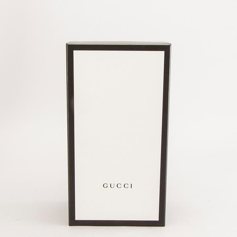 Gucci,.