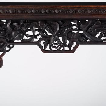 A massive zitan recessed-leg long table 'Jiaotousun Qiotouan', Qing dynasty, 19th century.