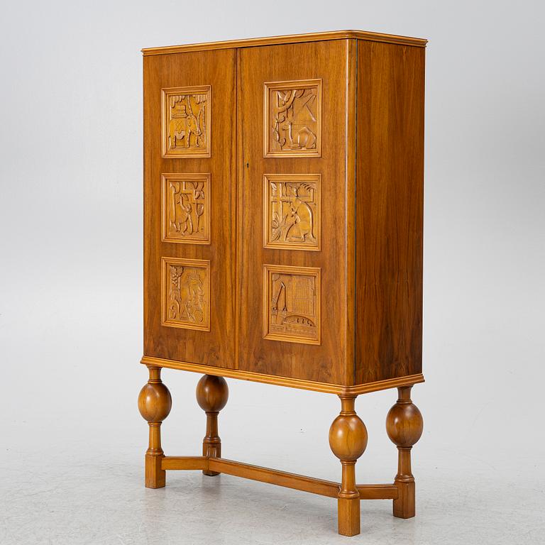 Eugen Höglund, a walnut cabinet, executed in his workshop in Vetlanda, Sweden 1950s.